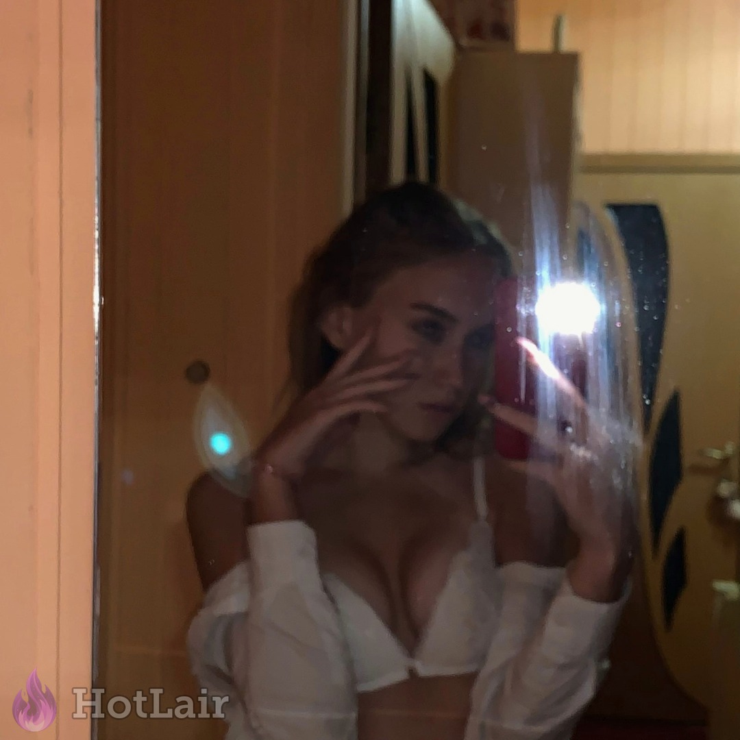 Hot mirror selfie with deep cleavage in white bra and unbuttoned shirt